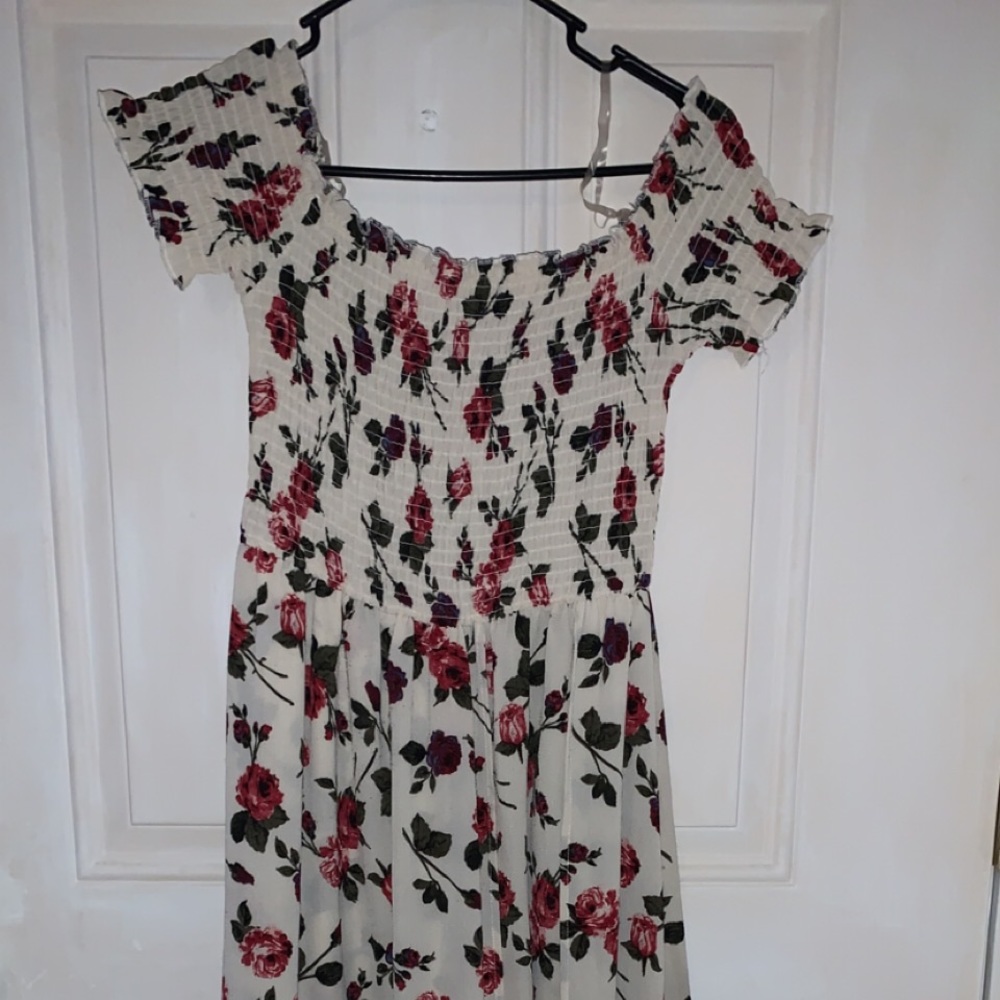 Large floor length, off the shoulder romper w/ floral patterns